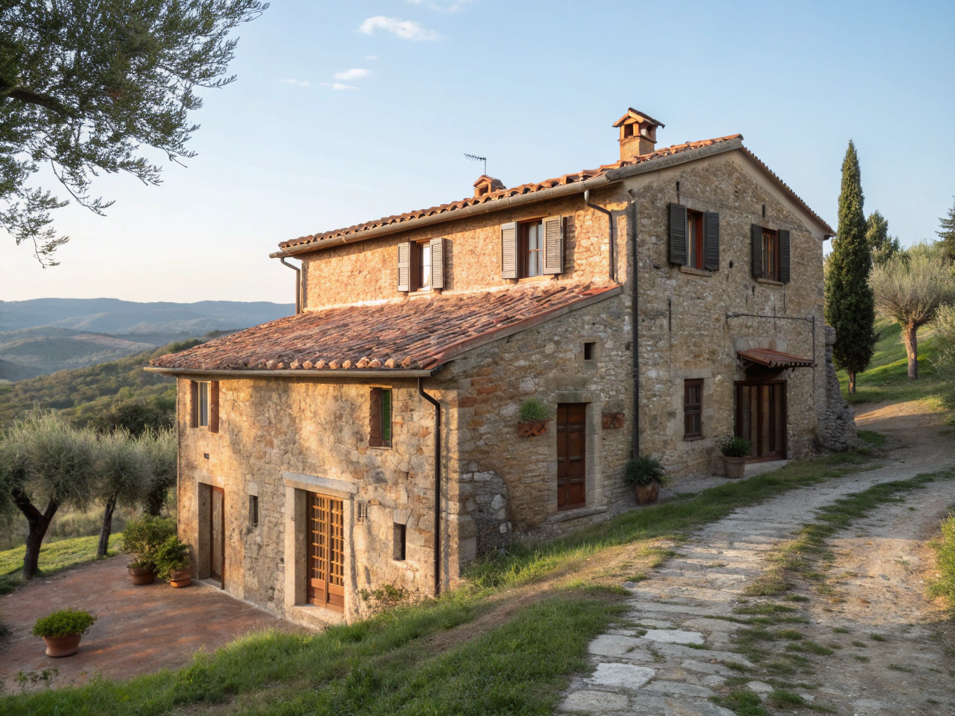 Casa Moricciani stone facade overlooking the Val d'Orcia hills