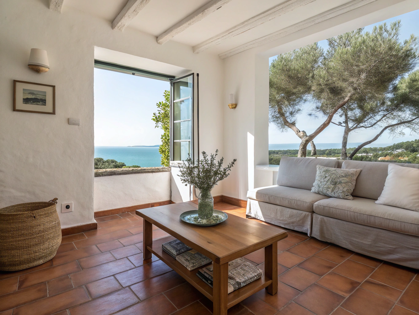 Sun-filled interior of Il Cielo apartment with rustic beams and terracotta floor
